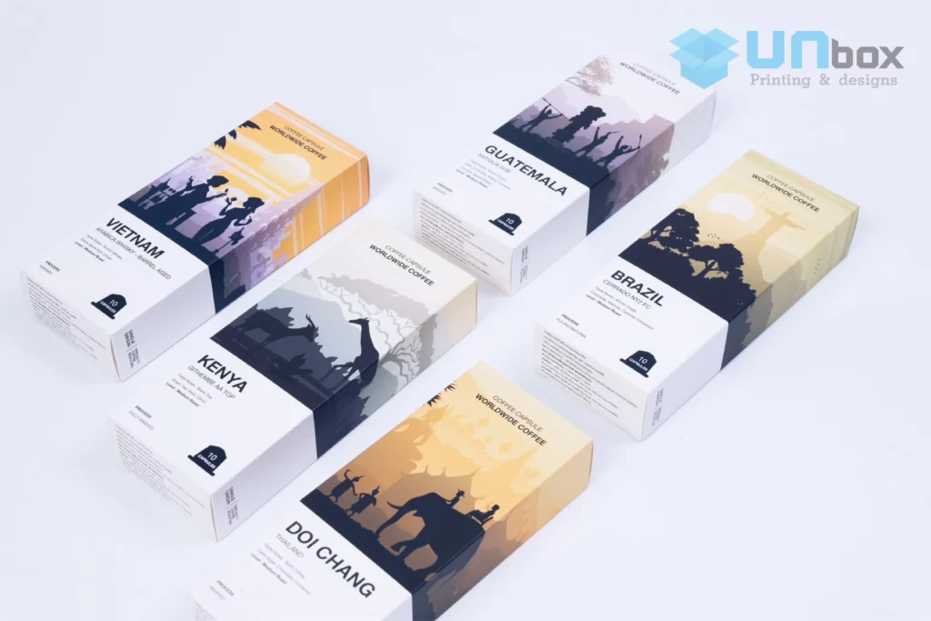 กล่องแคปซูลกาแฟทรงยาวซีรีส์แหล่งปลูกวางเรียงบนพื้นขาว ผลงานกล่องกาแฟของโรงพิมพ์ UNBOX